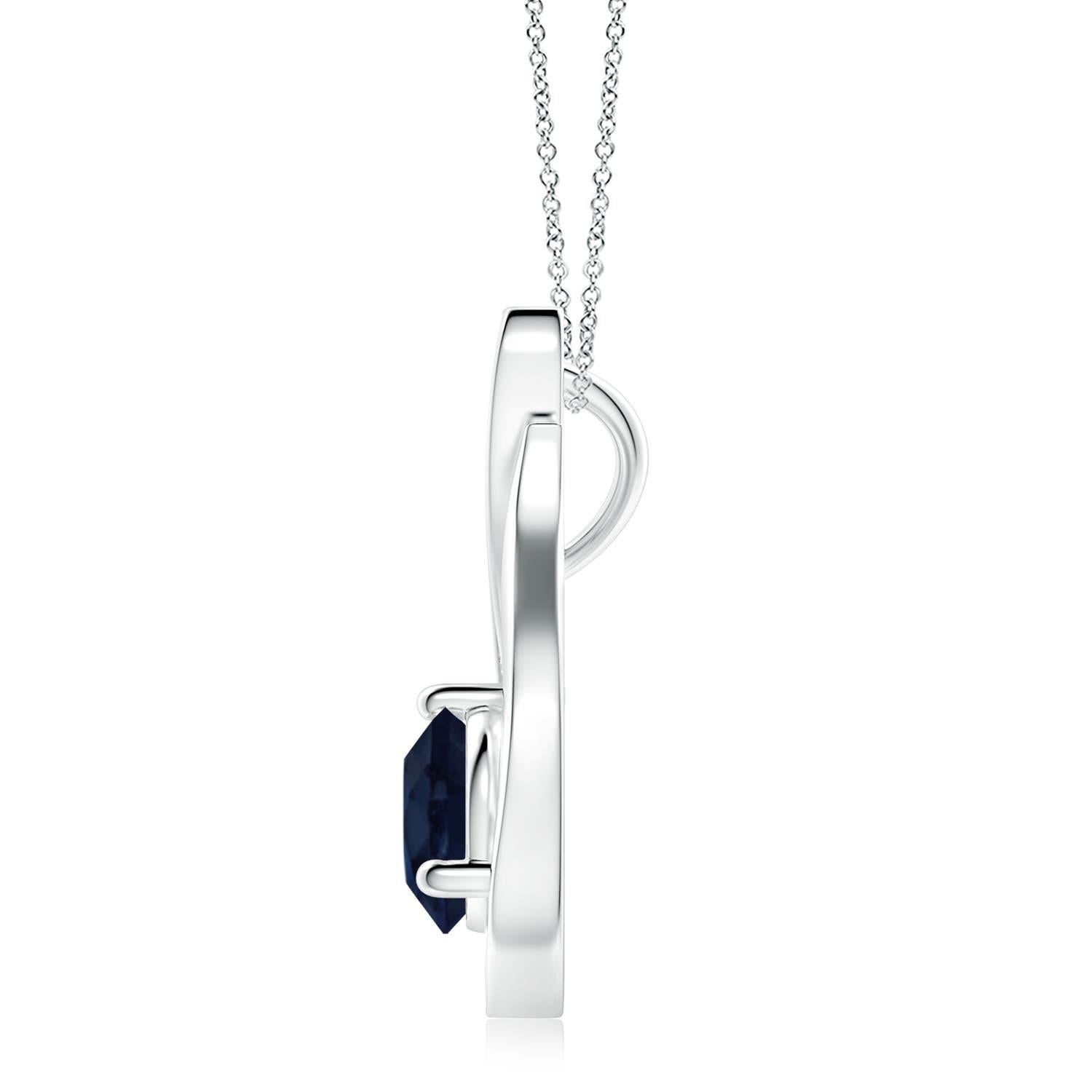 Un pendentif tulipe en platine orné d'un saphir bleu qui vous envoûtera par son éclat divin. Le modèle présente un saphir rond serti sur un anneau et des accents de diamants qui complètent magnifiquement l'éclat de la pierre précieuse, semblable à