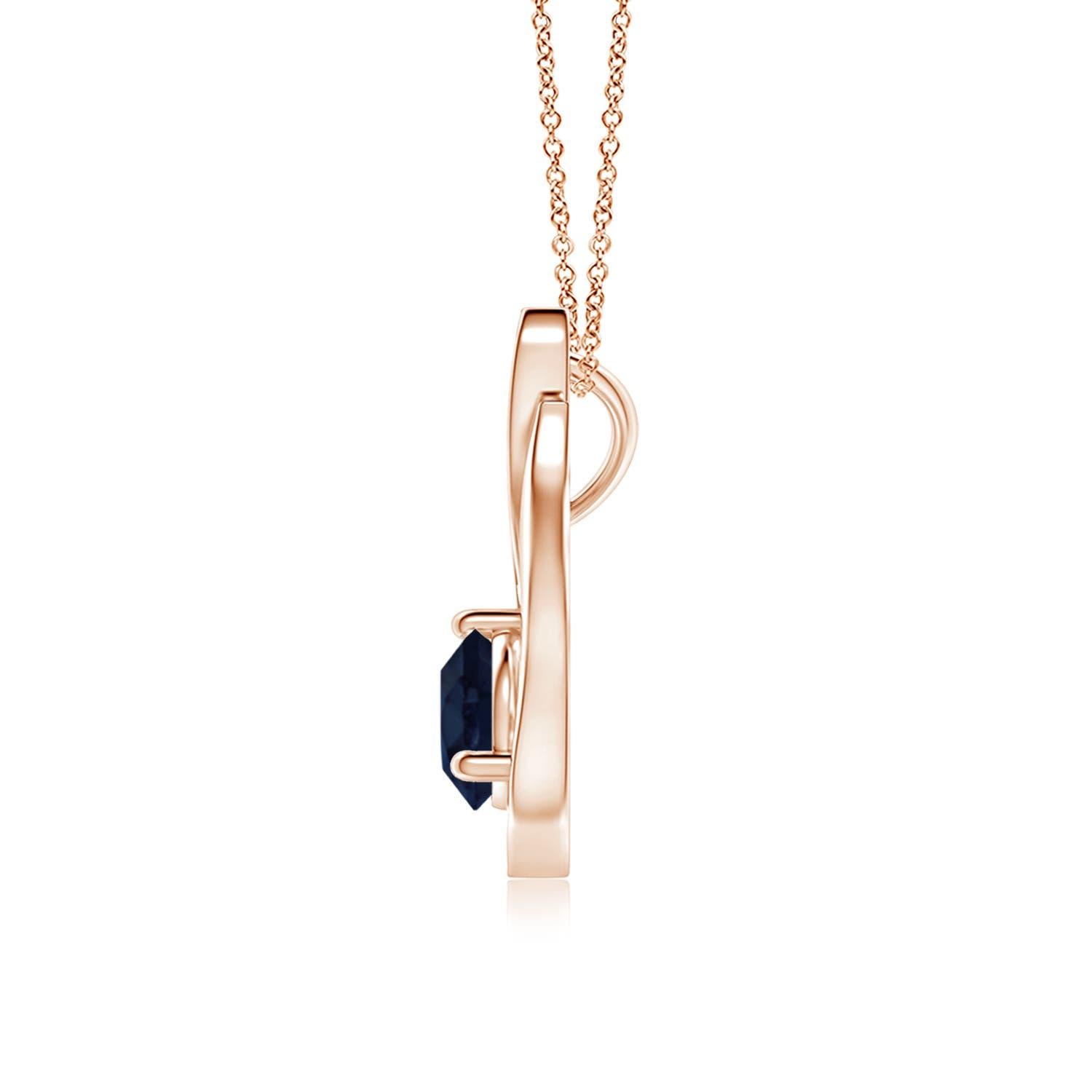 Un ciondolo a tulipano in oro rosa 14k con uno zaffiro blu che ti ipnotizzerà con il suo splendore divino. Il design è caratterizzato da uno zaffiro rotondo incastonato e da accenti di diamanti che completano splendidamente lo scintillio della