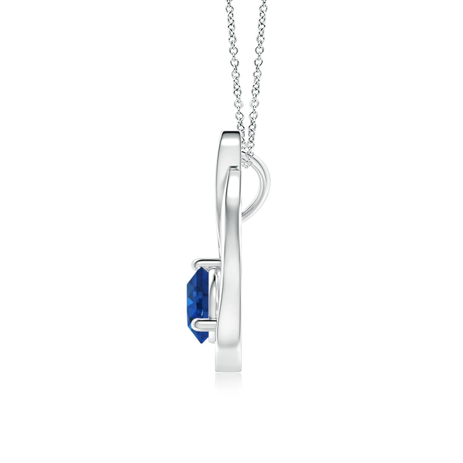 Un pendentif tulipe en or blanc 14k orné d'un saphir bleu pour vous envoûter de son éblouissement divin. Le modèle présente un saphir rond serti sur un anneau et des accents de diamant qui complètent magnifiquement l'éclat de la pierre précieuse,