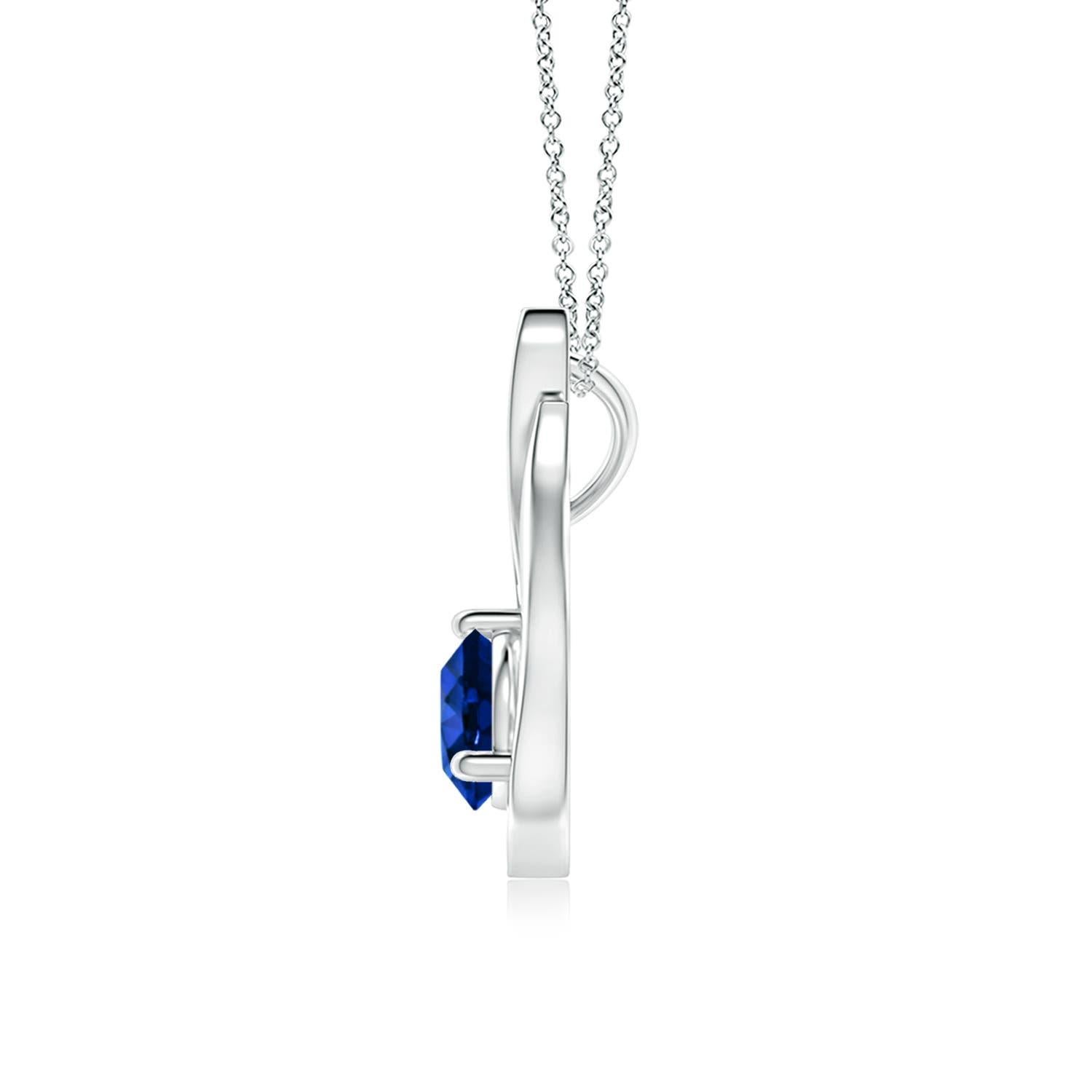 Un pendentif tulipe en platine orné d'un saphir bleu qui vous envoûtera par son éclat divin. Le modèle présente un saphir rond serti sur un anneau et des accents de diamant qui complètent magnifiquement l'éclat de la pierre précieuse, semblable à