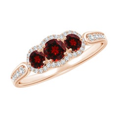 Bague Angara en or 14 carats, grenat flottant à trois pierres avec halo de diamants