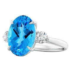 Angara Anillo de oro de 14 quilates con tres piedras de topacio azul suizo de 7,22 ct, certificado por el GIA