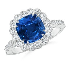 Anello con zaffiro a cuscino certificato GIA Nature di Angara con alone floreale in oro 14K