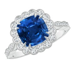 Anello con zaffiro a cuscino certificato GIA Nature di Angara con alone floreale in oro 14K