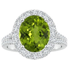 Anello con peridoto ovale da 3,29 carati e diamante in oro 14 carati, certificato GIA da Angara.