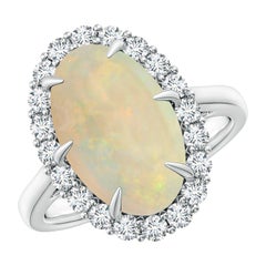 Angara Anillo de Ópalo Ovalado Natural Certificado GIA de 3,82 ct con Halo de Diamantes en Oro de 14K