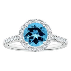 Angara Anillo de oro de 14 quilates con halo de topacio azul suizo, redondo, certificado por el GIA, natural, de 1,56 ct