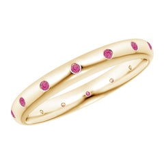 Anello di eternità con zaffiro rosa rotondo incastonato di Angara, in oro massiccio 14 carati