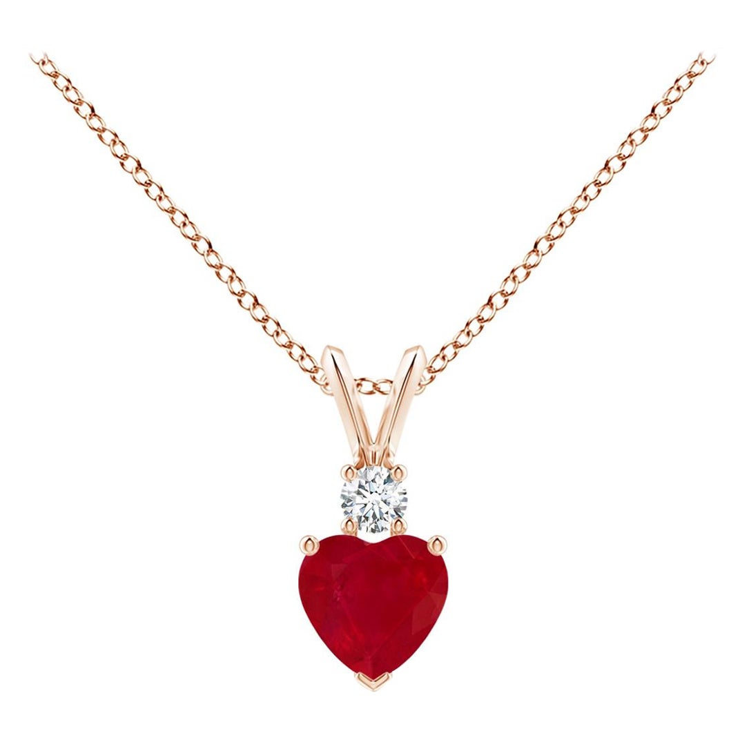 ANGARA Natural Heart-Shaped 0.55ct Ruby Rabbit Ear Bale Pendant in Rose Gold