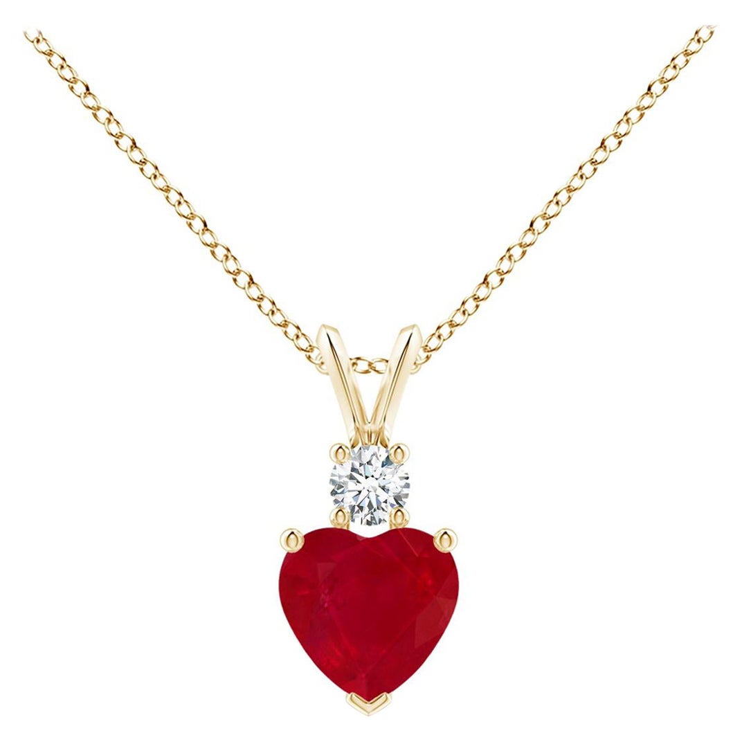 ANGARA Natural Heart-Shaped 0.80ct Ruby Rabbit Ear Bale Pendant in Yellow Gold