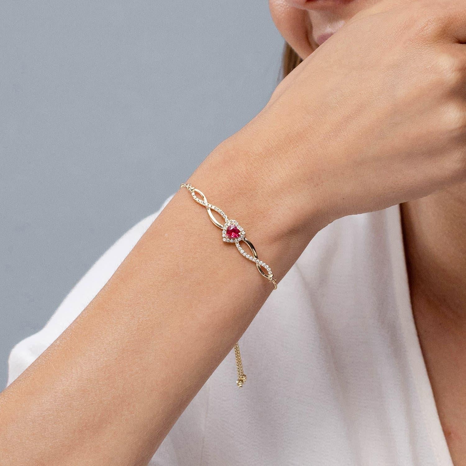 Heart Cut Angara Natural Heart-Shaped Ruby Infinity Bolo Bracelet in 14K Gold for Women For Sale