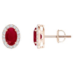 ANGARA Natural Oval 1.20ct Ruby Studs with Diamond Halo in 14K Rose Gold