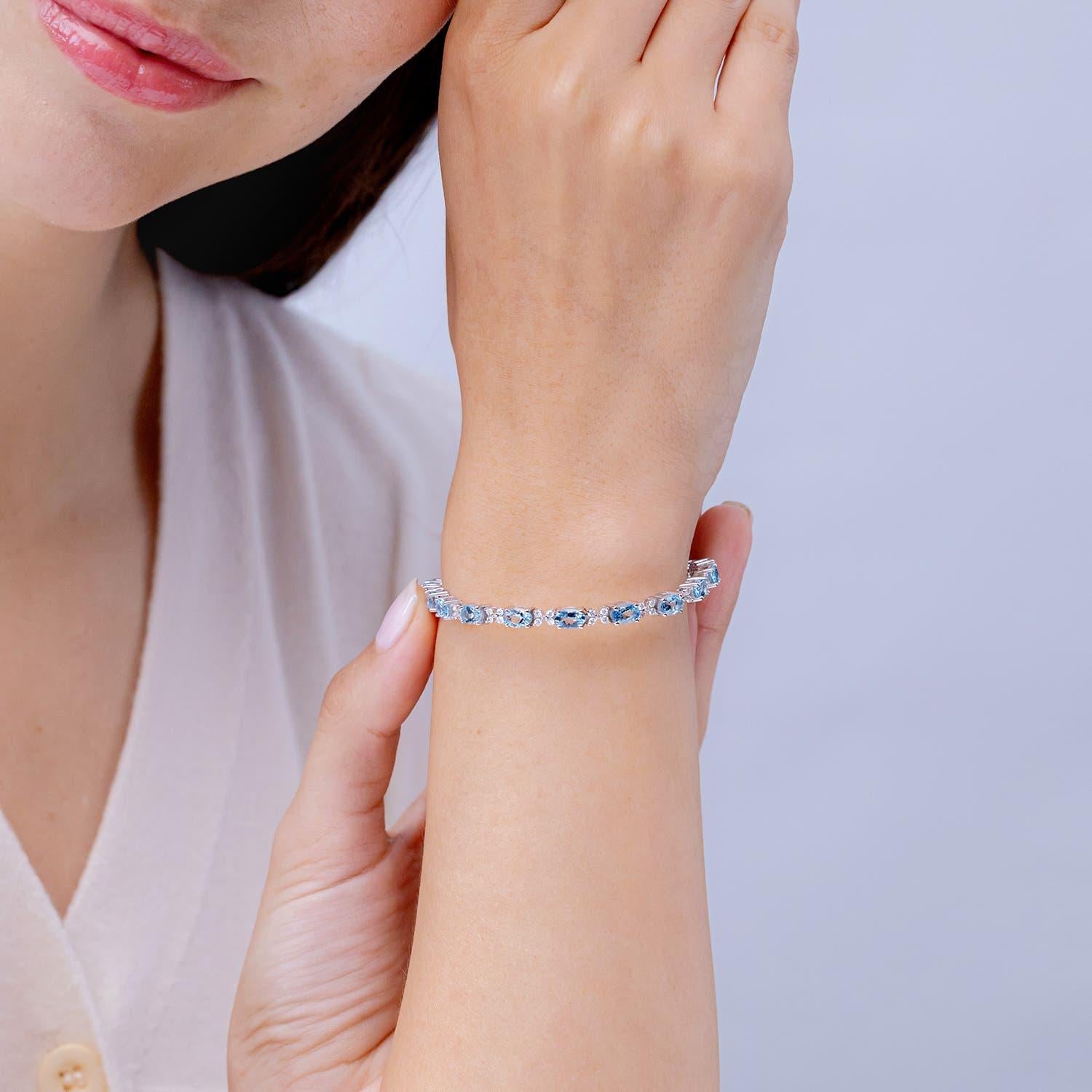 Modern Angara Natural Oval 7.2 ct Aquamarine Tennis Bracelet with Diamonds in 14K Gold For Sale