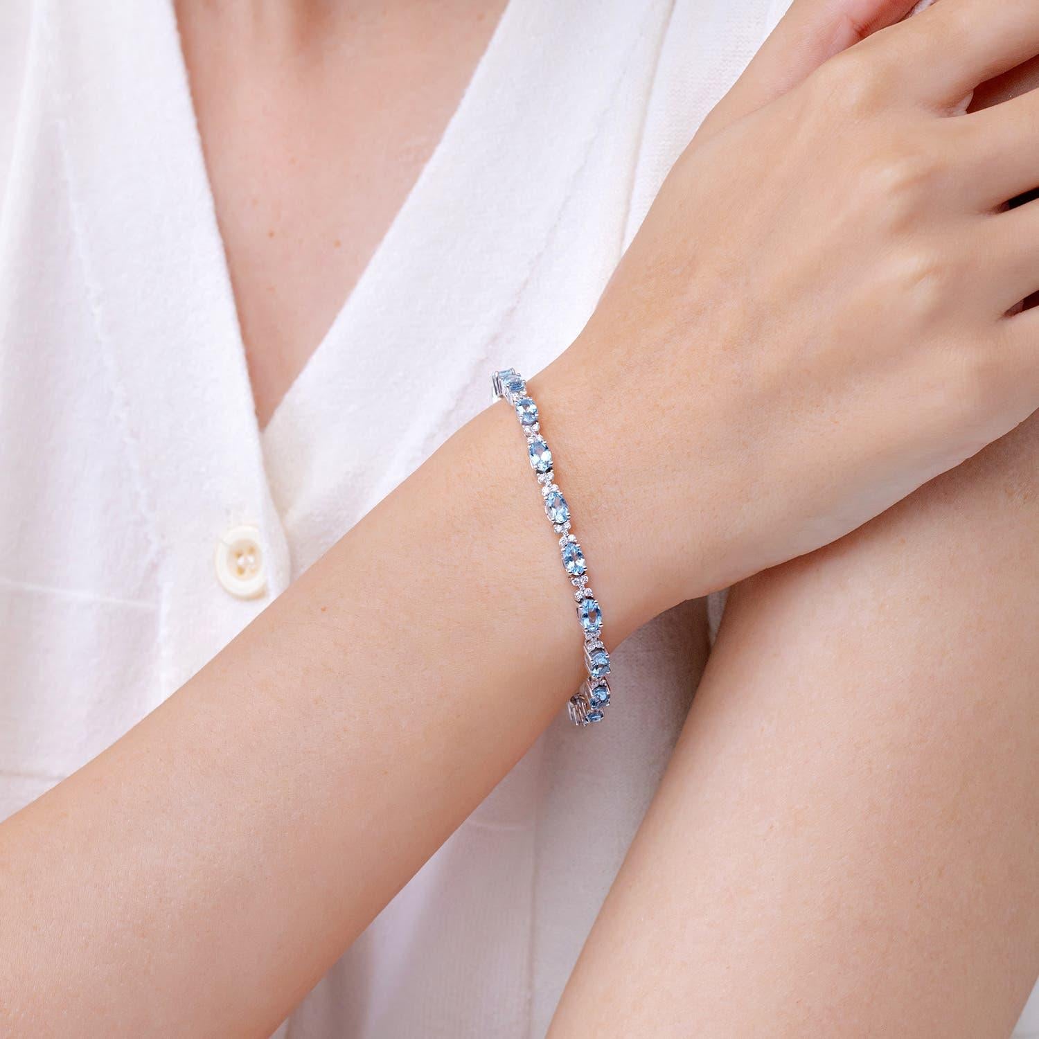 Oval Cut Angara Natural Oval 7.2 ct Aquamarine Tennis Bracelet with Diamonds in 14K Gold For Sale