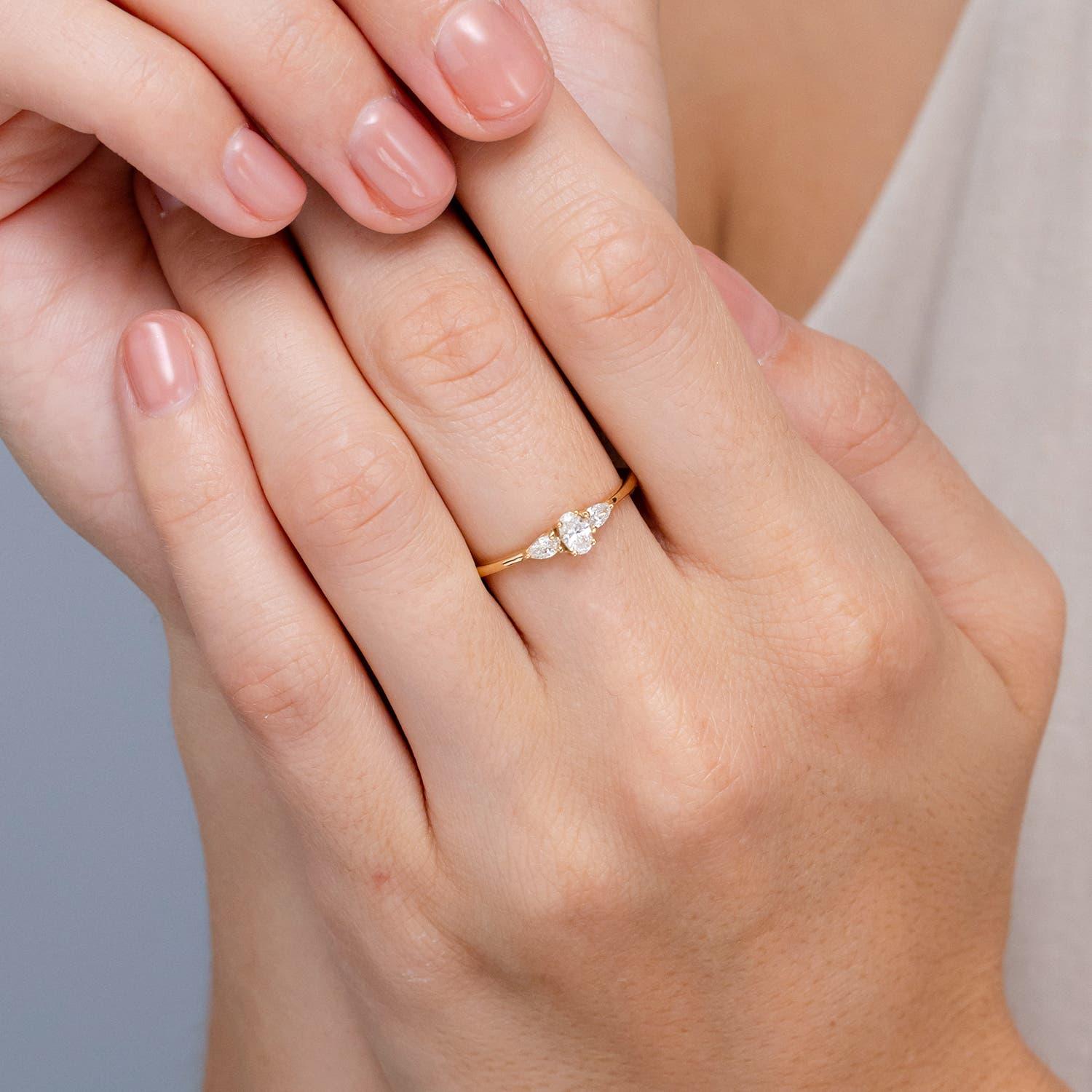 Modern Angara Natural Oval and Pear-Shaped Diamond Three Stone Ring in 14K Solid Gold For Sale