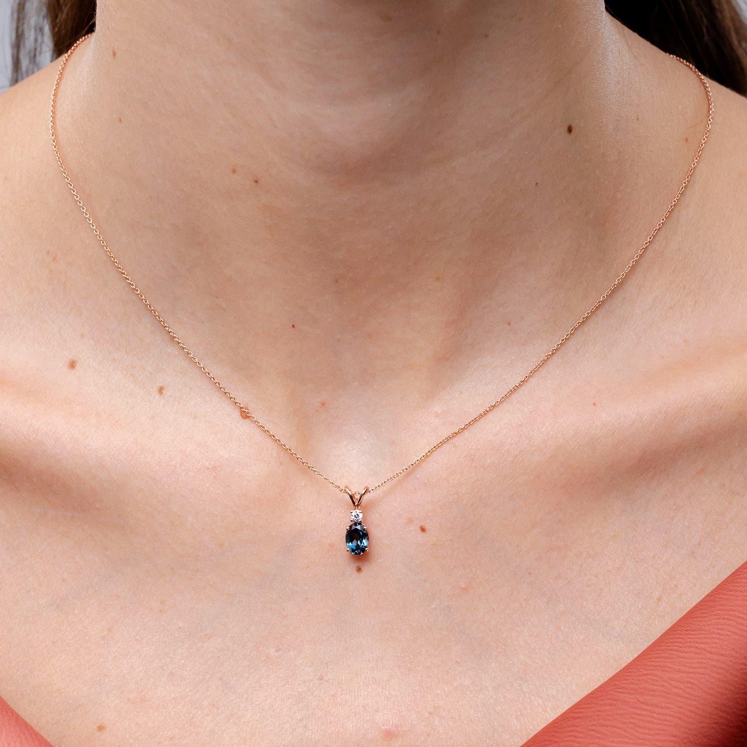 Modern Angara Natural Oval London Blue Topaz Solitaire Pendant with Diamond in 14K Gold For Sale