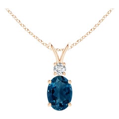 Angara Natural Oval London Blue Topaz Solitaire Pendant with Diamond in 14K Gold