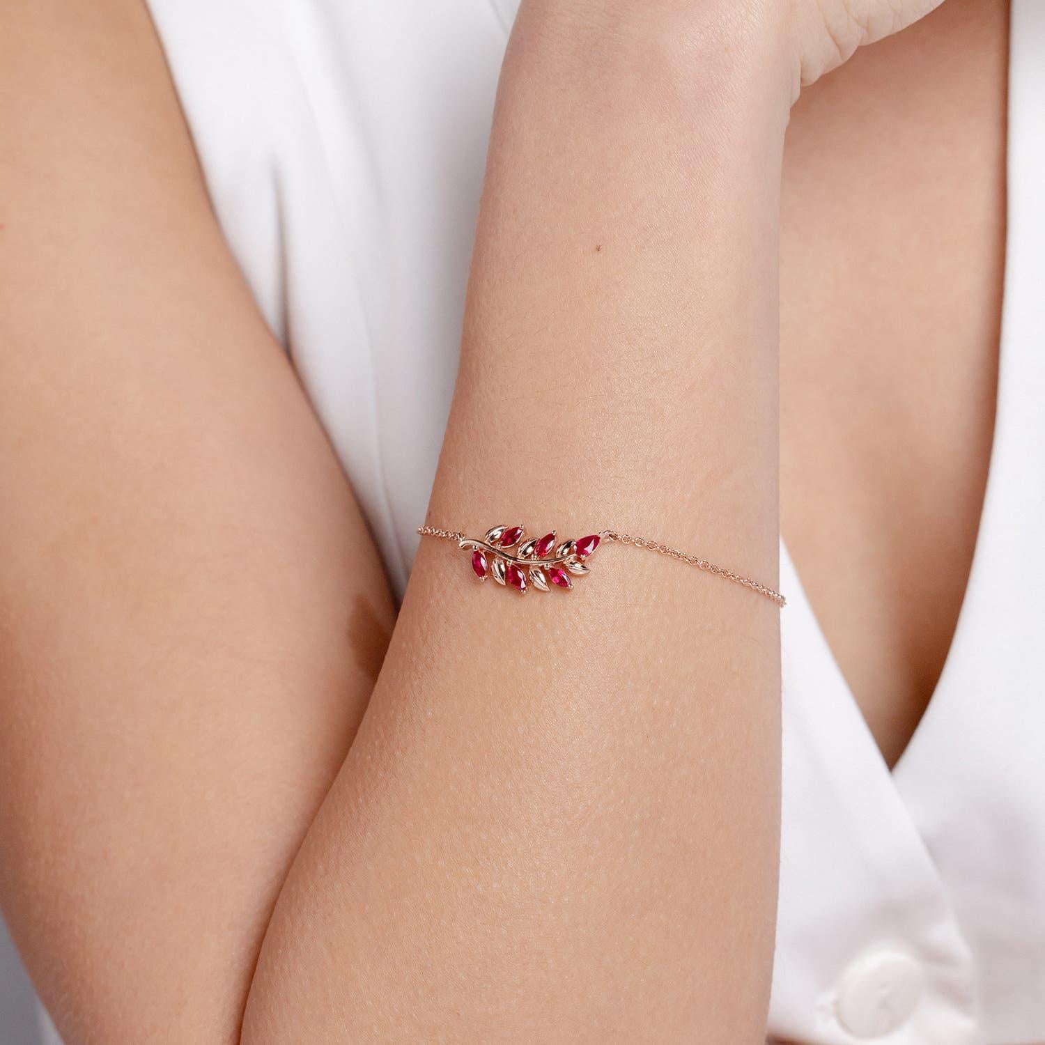 Modern Angara Natural Pear and Marquise Ruby Olive Branch Bracelet in 14K Solid Gold For Sale