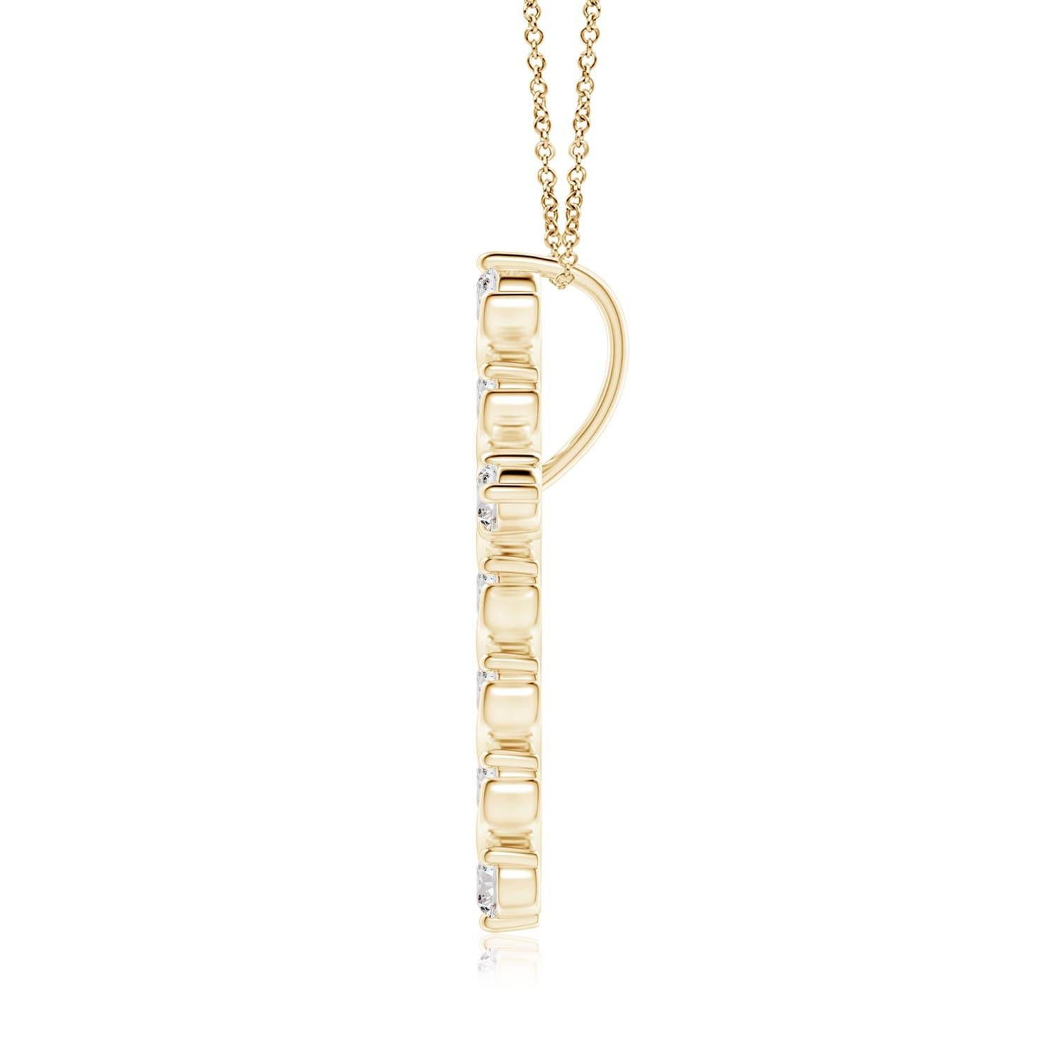 Dieser Kreuzanhänger aus 14-karätigem Gelbgold hat einen Hauch von fließender Eleganz und versprüht femininen Charme. Die Brillanten sind in einer einzigartigen Zacken- und Spangenfassung inmitten wirbelartiger Details befestigt und sorgen für einen