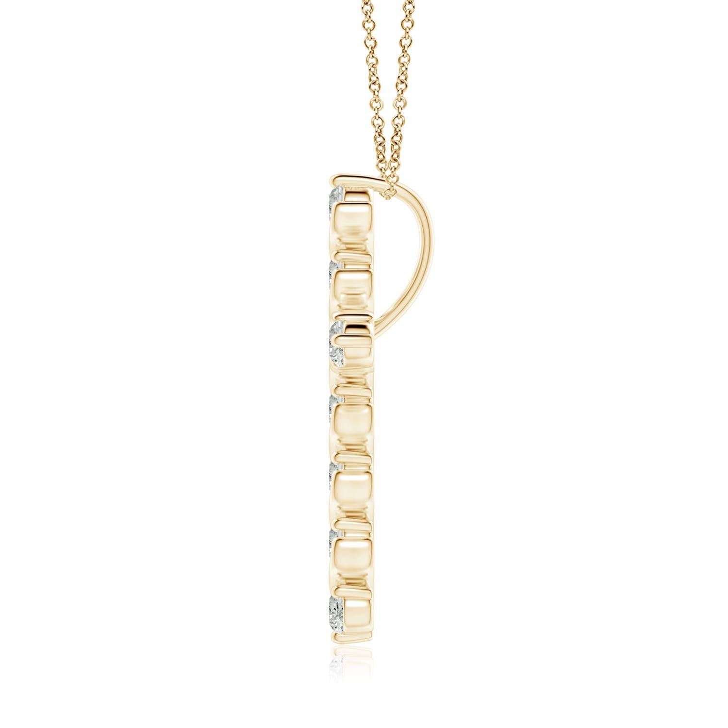 Dieser Kreuzanhänger aus 14-karätigem Gelbgold hat einen Hauch von fließender Eleganz und versprüht femininen Charme. Die Brillanten sind in einer einzigartigen Zacken- und Spangenfassung inmitten wirbelartiger Details befestigt und sorgen für einen