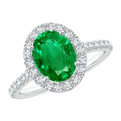 Anello con smeraldo ovale da 1,5 carati con diamante aureolato Angara Nature con incastonatura a forcella in oro 14 carati