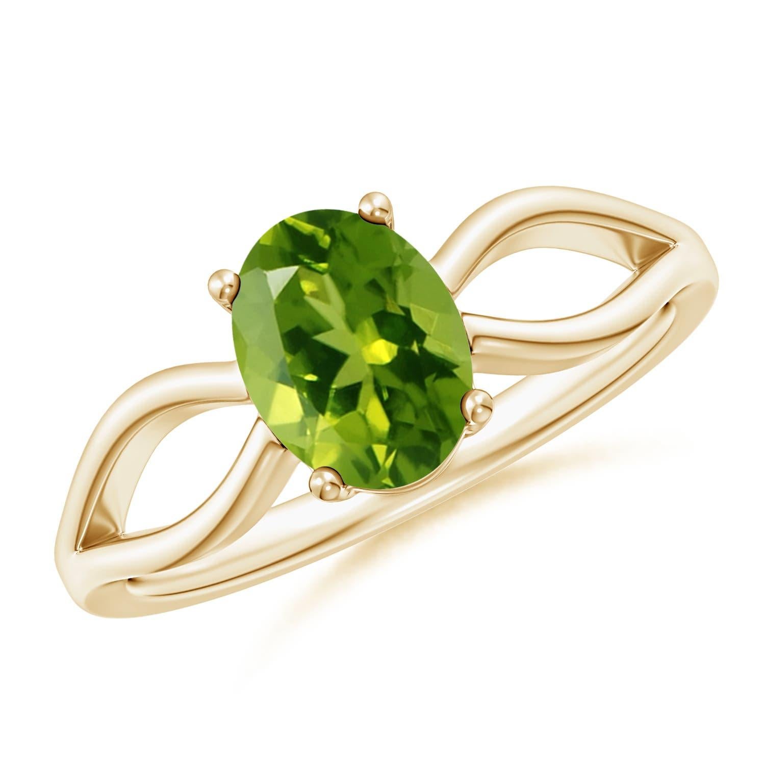 Anillo Angara de oro macizo de 14 quilates con solitario natural engastado de 1,35 quilates de peridoto en venta 1
