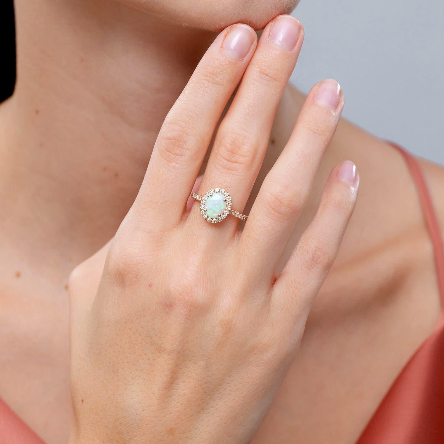Modern Angara Natural ProngSet Oval 1.1ct Opal Halo Ring with Diamond in 14K Solid Gold For Sale