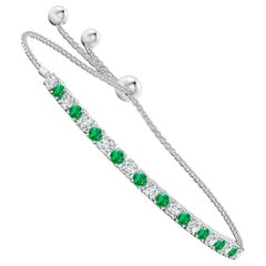 Angara Esmeralda Natural Redonda de 1 ct y Diamante Pulsera Bolo de Tenis en Oro de 14K