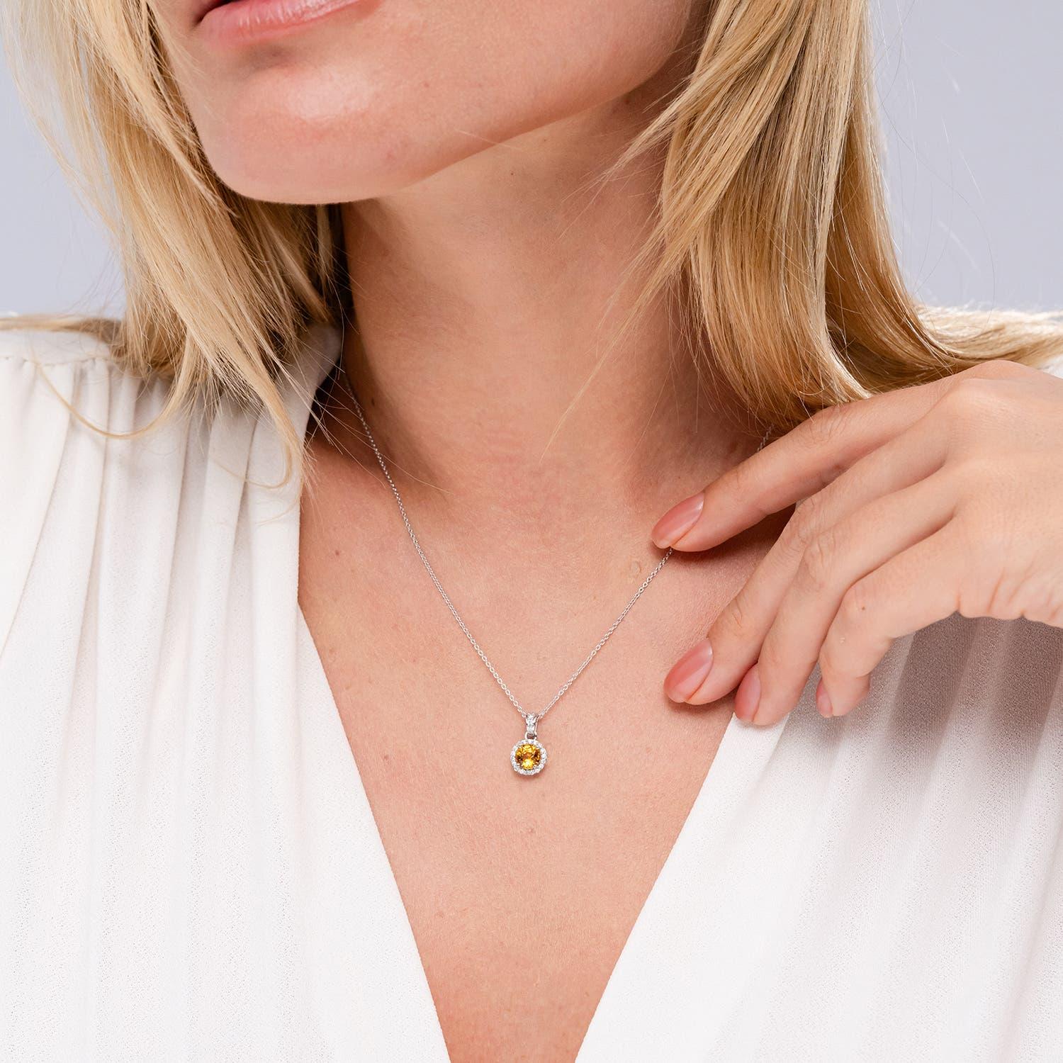 Modern Angara Natural Round 1 ct Yellow Sapphire Pendant with Diamond Halo in 14 Gold For Sale