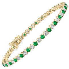 Angara Esmeralda Natural Redonda de 1,44 ct y Pulsera de Tenis de Diamantes en Oro de 14K