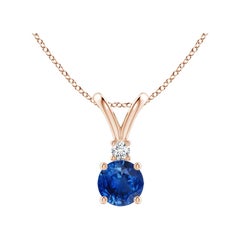 Colgante solitario de zafiro azul redondo natural y diamante Angara en oro rosa de 14 quilates