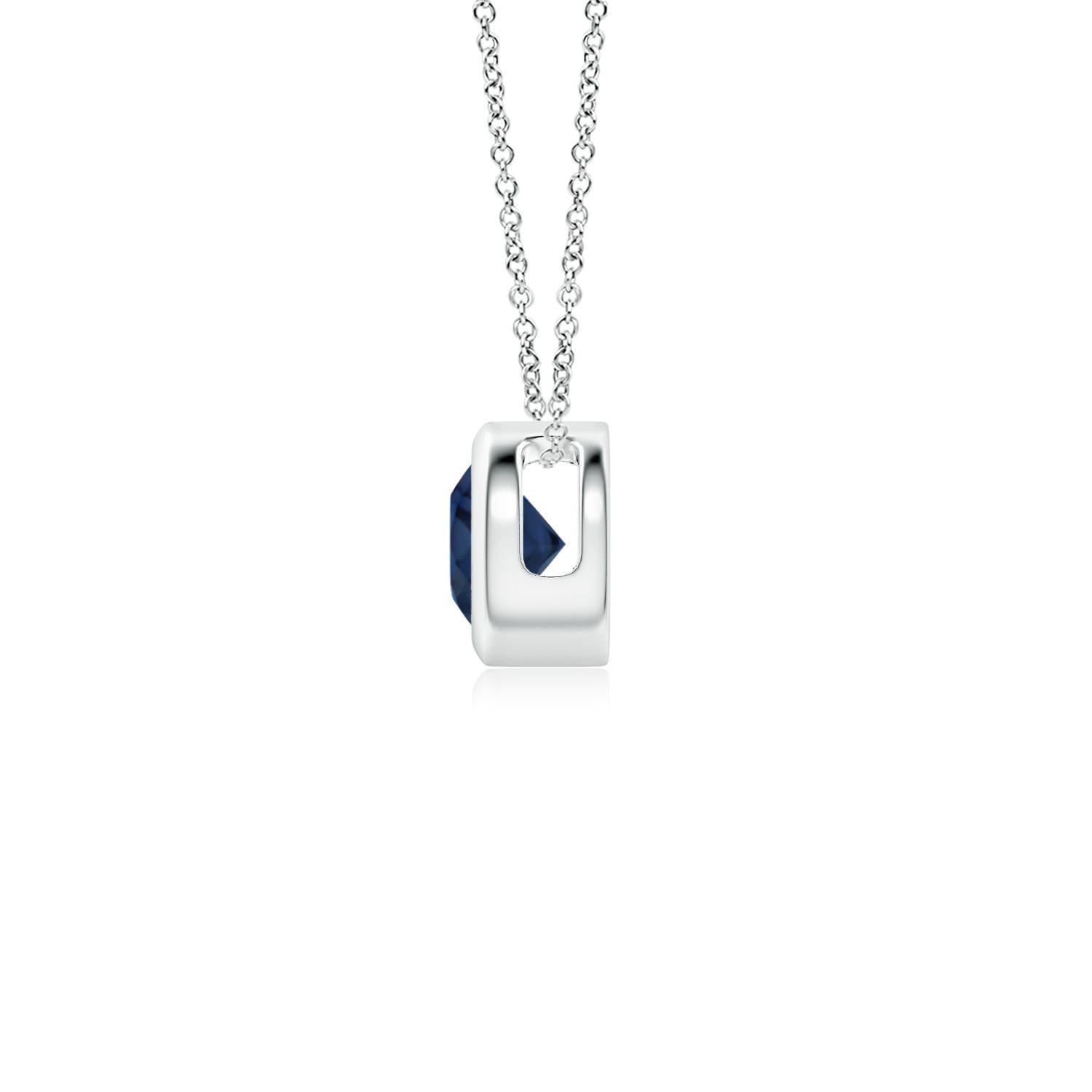 This classic solitaire sapphire pendant's beautiful design makes the center stone appear like it's floating on the chain. The radiant blue gem is secured in a bezel setting. Crafted in 14k white gold, this round sapphire pendant is simple yet