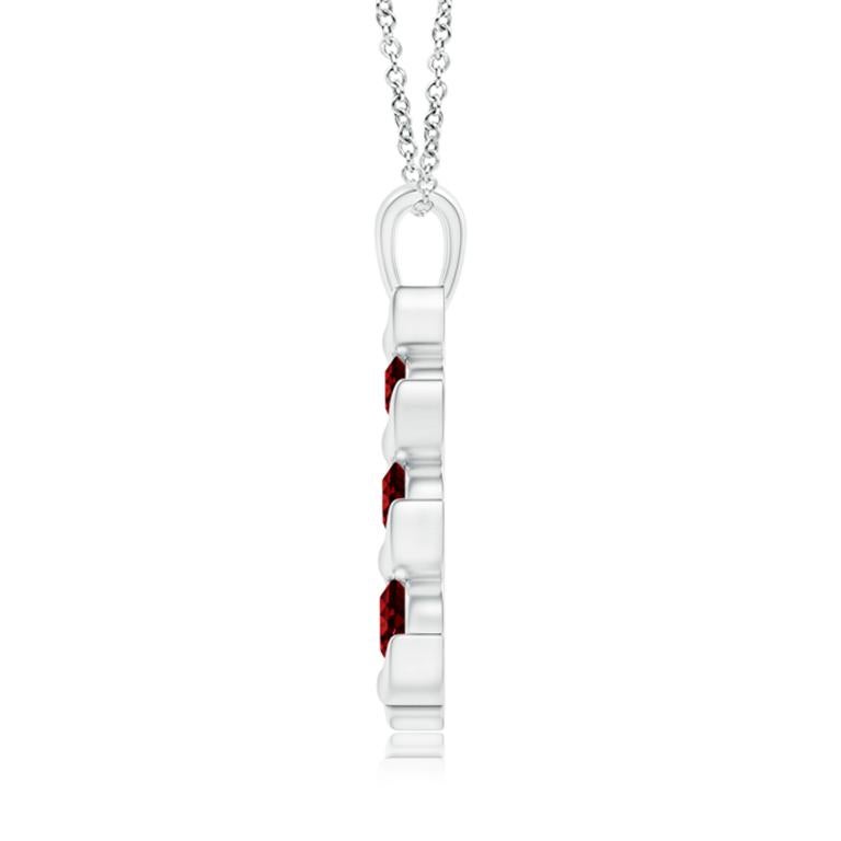 Channel set in an exquisite journey trail, the three graduating round rubies exude their bold and striking red hue. This gorgeous three stone ruby pendant is designed in 14K white gold and connects to a lustrous metal bale.
Ruby is the birthstone