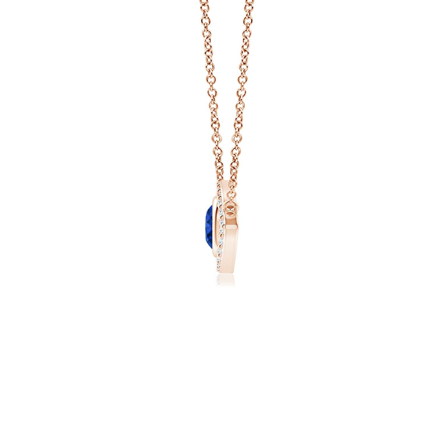 Hanging gracefully from a shiny metal bale is a diamond studded frame with a round sapphire bezel set at the center. The sparkling diamonds create a compelling contrast against the deep blue sapphire. Crafted in 14k rose gold, this sapphire evil eye