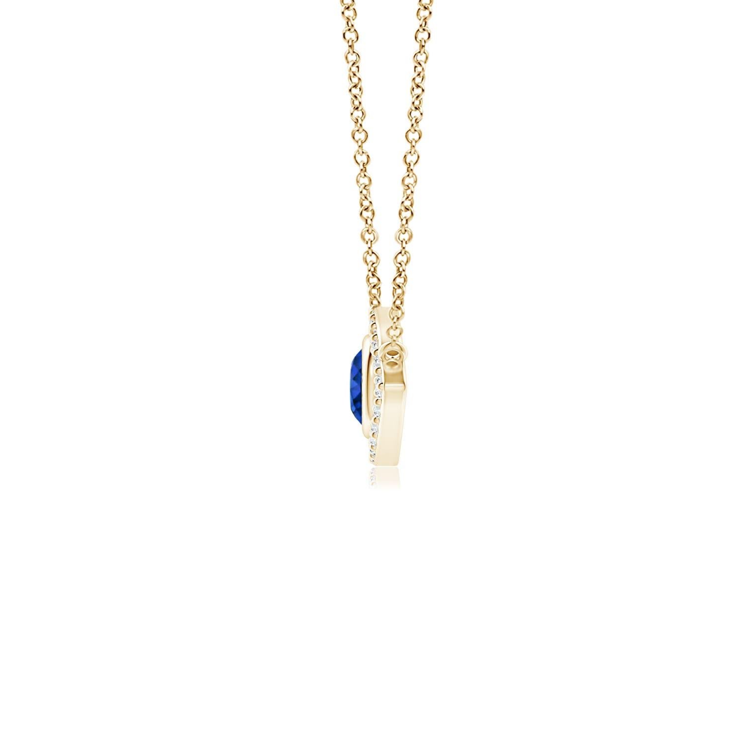 Hanging gracefully from a shiny metal bale is a diamond studded frame with a round sapphire bezel set at the center. The sparkling diamonds create a compelling contrast against the deep blue sapphire. Crafted in 14k yellow gold, this sapphire evil