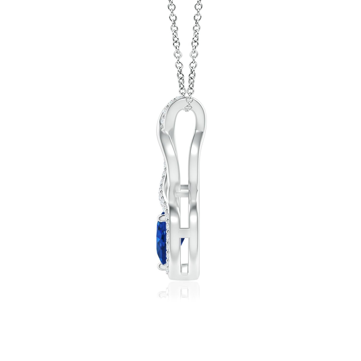 A diamond studded strip entwines with a lustrous metal strip to form an ornate infinity. Floating amid the graceful infinity is a beautiful heart-shaped blue sapphire in a prong setting. The sparkling diamonds infuse a captivating edge to this