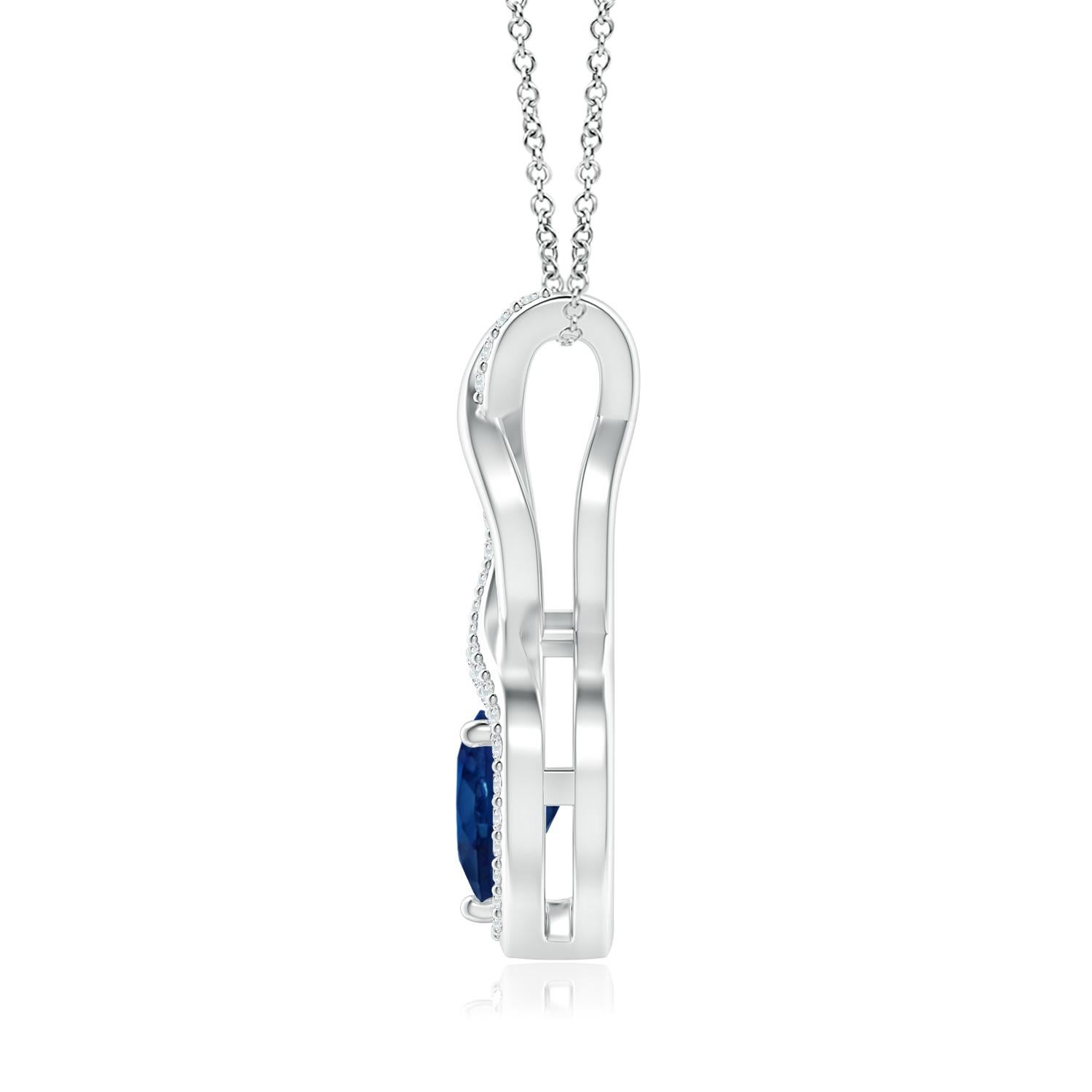A diamond studded strip entwines with a lustrous metal strip to form an ornate infinity. Floating amid the graceful infinity is a beautiful heart-shaped blue sapphire in a prong setting. The sparkling diamonds infuse a captivating edge to this