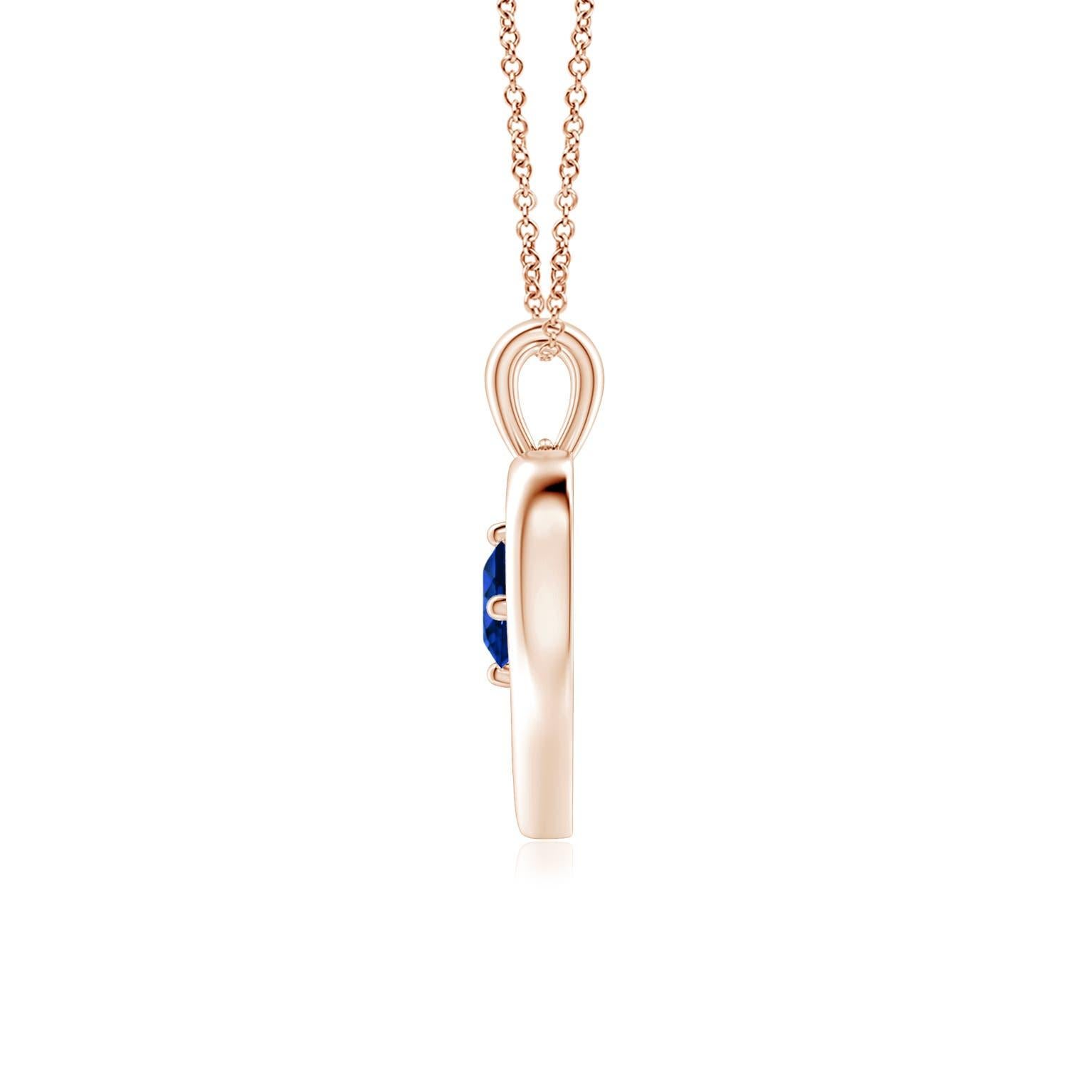Ce resplendissant pendentif à cœur ouvert en or rose 14k serti de saphirs est à la fois simple et magnifique. L'agréable pierre précieuse bleue semble hypnotisante en combinaison avec le cadre lustré en forme de cœur ouvert.
Le saphir bleu est la