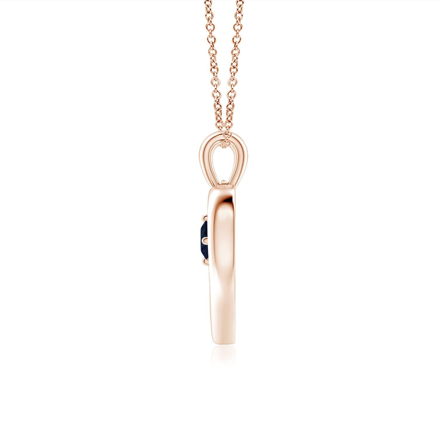 Ce resplendissant pendentif à cœur ouvert en or rose 14k serti de saphirs est à la fois simple et magnifique. L'agréable pierre précieuse bleue semble hypnotisante en combinaison avec le cadre lustré en forme de cœur ouvert.
Le saphir bleu est la