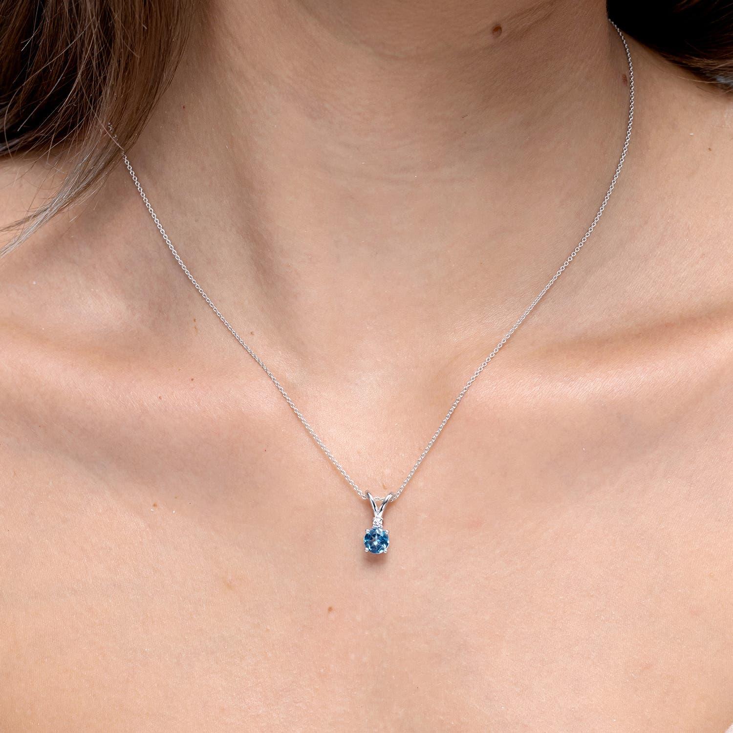 Modern Angara Natural Swiss Blue Topaz Solitaire Pendant with Diamond in 14K White Gold For Sale