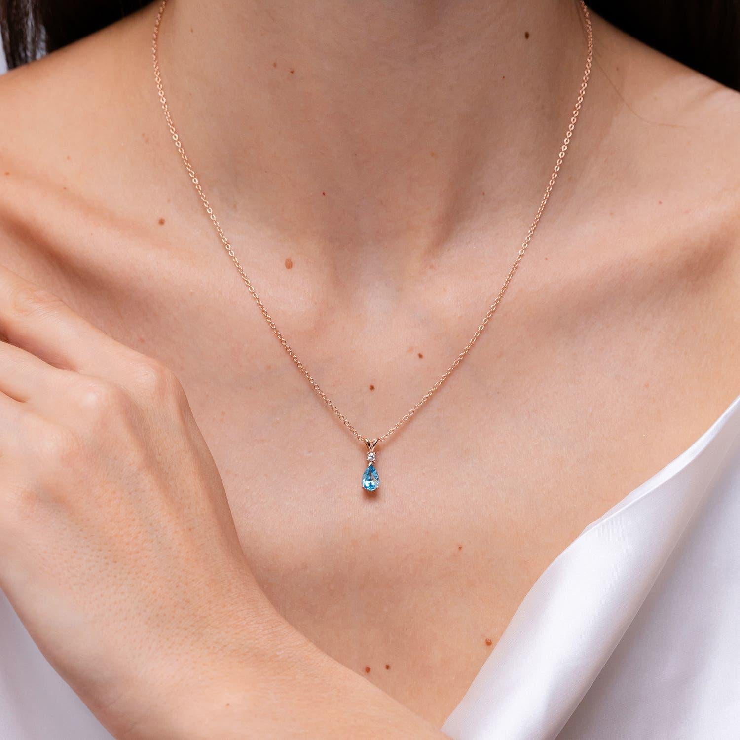 Modern Angara Natural Swiss Blue Topaz Teardrop Pendant with Diamond in 14K Solid Gold For Sale