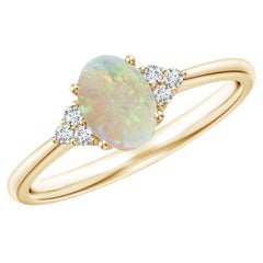 Angara Natural Tapered Shank Oval Opal Ring with Trio Diamond in 14K Solid Gold