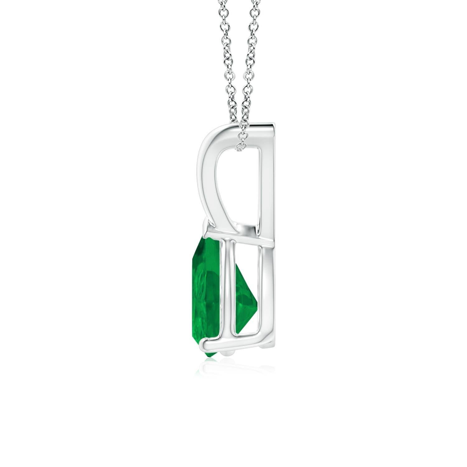 Suspended from a V bale is a glimmering emerald in a beautiful pear shape. It is held in a prong setting with a V prong securing the pointed end. Crafted in platinum, this emerald drop pendant allures with its lush forest green hue.
Emerald is the