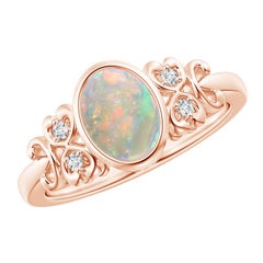 Angara Natural Vintage Style Bezel-Set Oval Opal Ring with Diamonds in 14K Gold