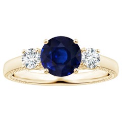 ANGARA Anello a tre pietre con zaffiro blu certificato GIA e diamante a foglia in oro giallo
