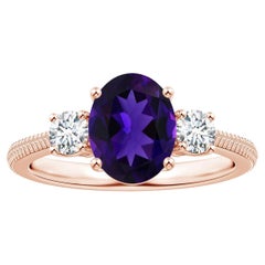 Anello con piuma di ametista ovale naturale a tre pietre certificato GIA in oro rosa 18 carati