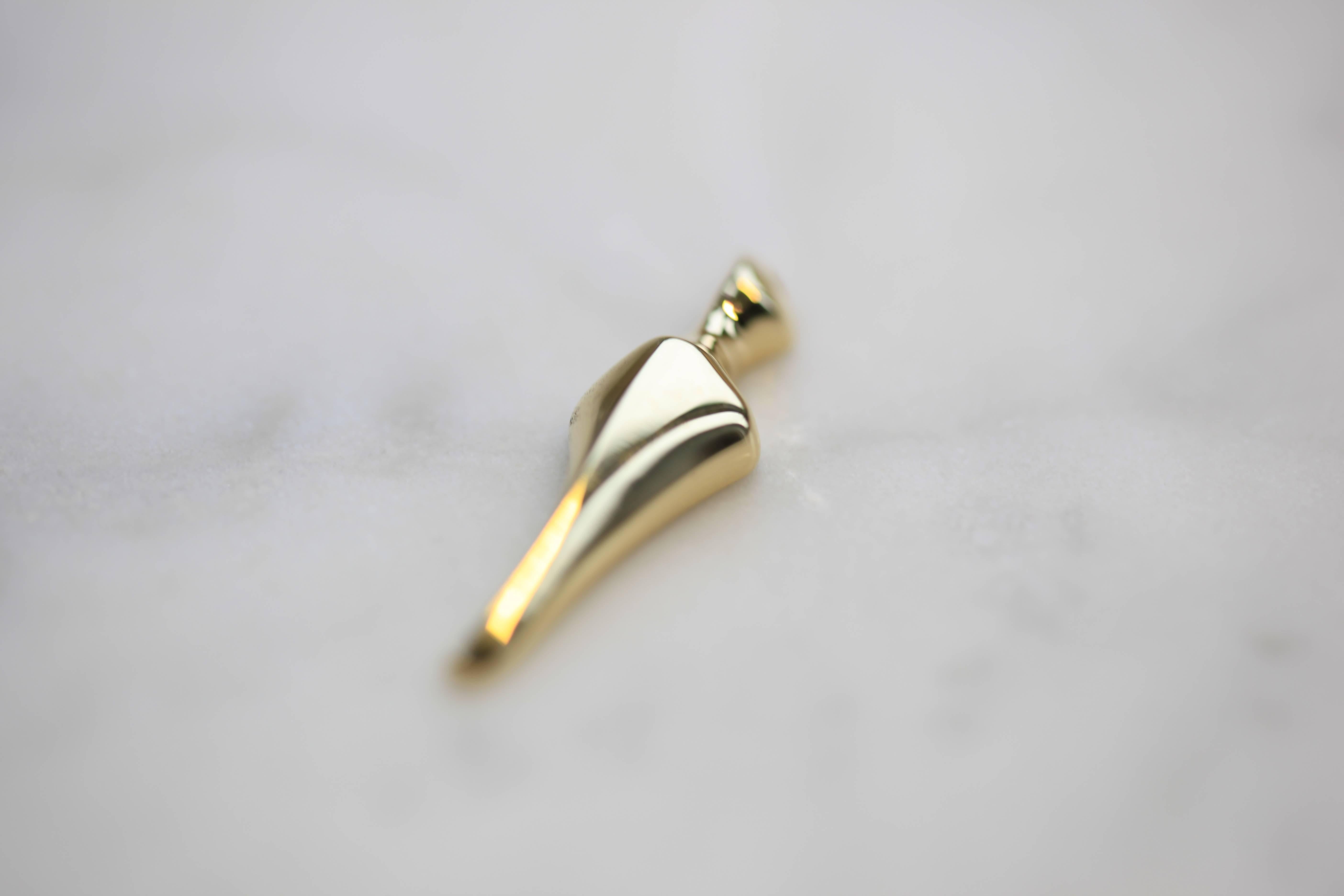 Angel #2 is a unique creation by hugely talented jewelry designer Costas Domnidis, founder of Noussoma. A very elegant and delicate piece of a more undefined human form, it is an 18-karat solid gold pendant in yellow gold, with a unique golden clasp