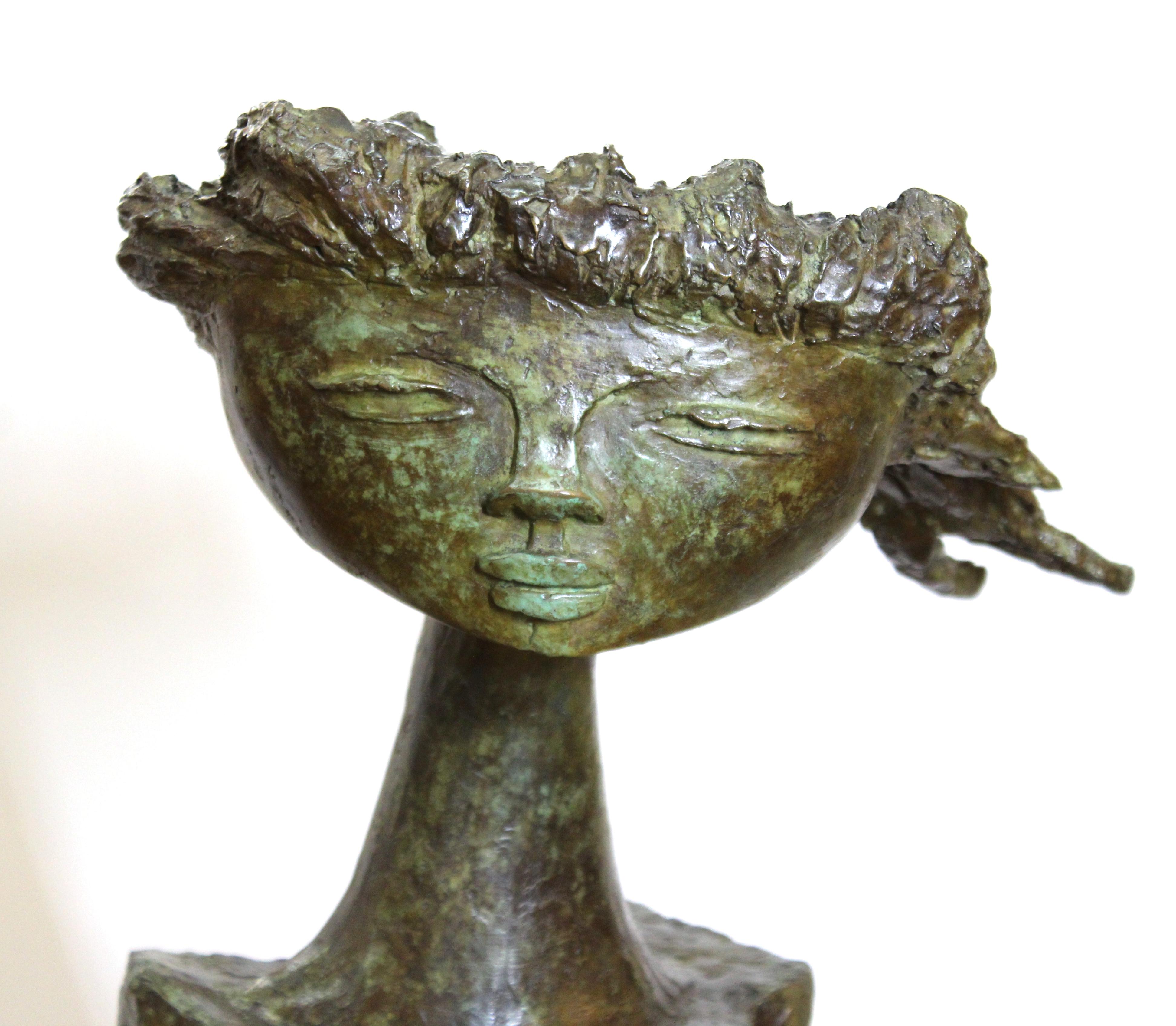 Angel Botello (1913-1986) 'Coup de Vent II' signed and numbered '8/10' modern bronze sculpture of a girl with her hair blowing in the wind. Artist signature, edition number and foundry mark located on the base. Made in circa 1975. In great vintage