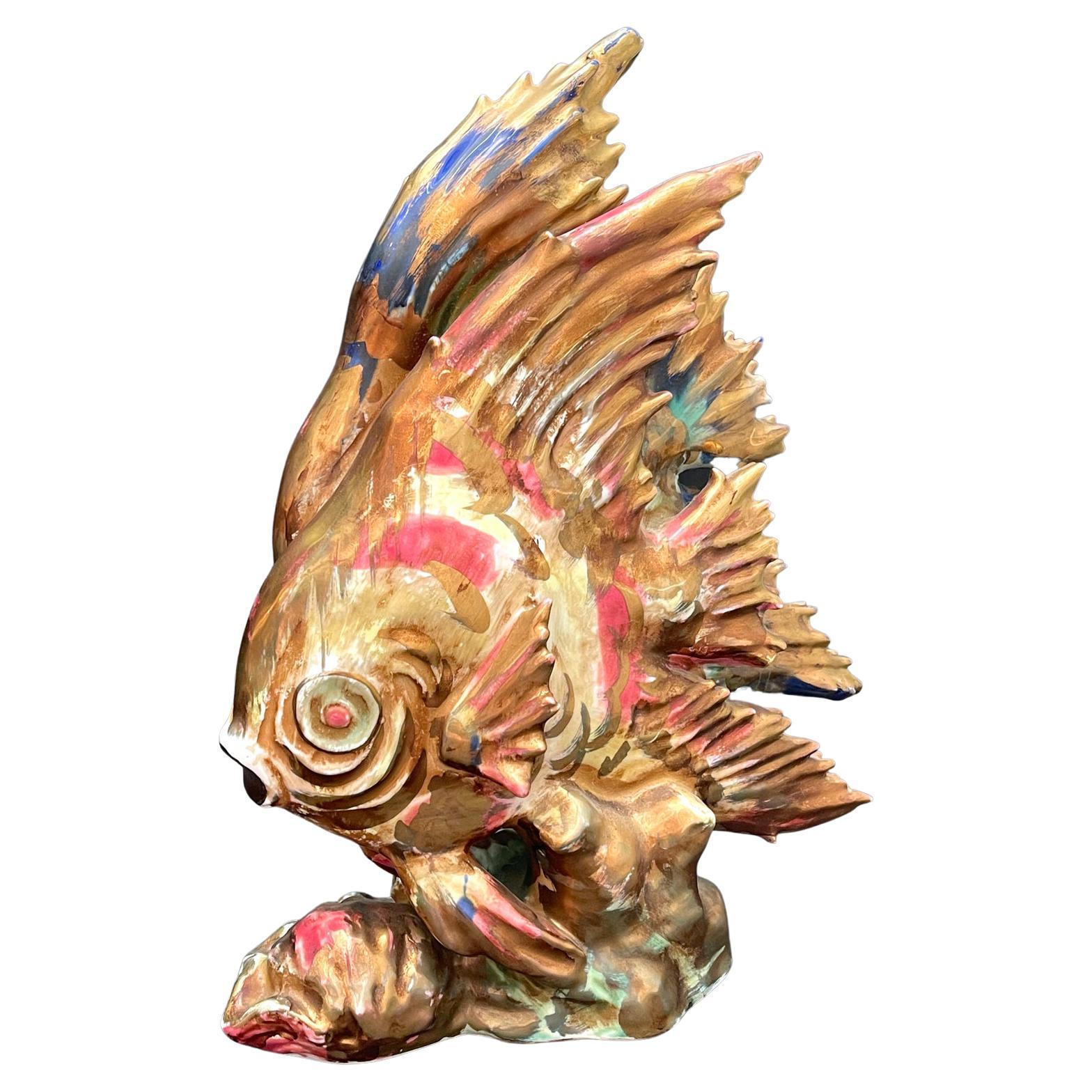 This pair of technicolor-hued Art Deco angel fish sculptures -- glazed in hues of gold, dark pink, cobalt, sea green and canary -- was made in Japan between 1945 and 1951, when American forces occupied the nation after World War II and required that