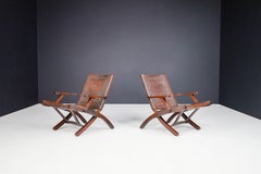 Angel I. Pazmino Cognac-colored Saddle Leather Arm Chairs Ecuador 1970s